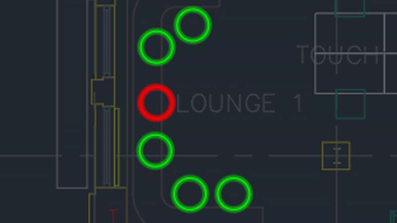 CAD design showing green and red circular markers arranged in a curved pattern on a dark background.