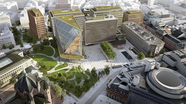 Oslo’s structured collaboration solves complex issues for new government builds In a rendering, an aerial view shows a city district featuring modern buildings surrounded by green spaces and wide pedestrian areas.