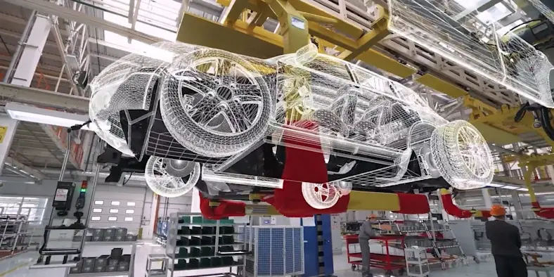 Image of an auto factory with a digital overlay of a car
