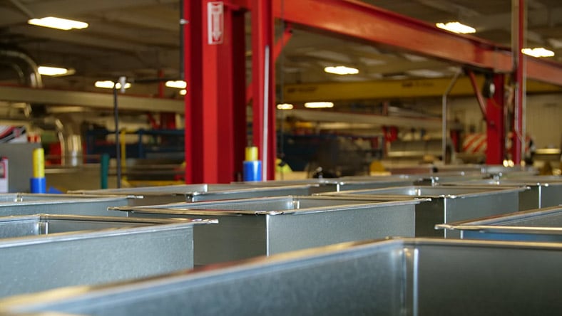 Multitrade skids in an offsite fabrication shop.