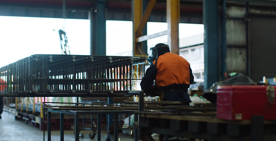 Steel worker in steel factory.