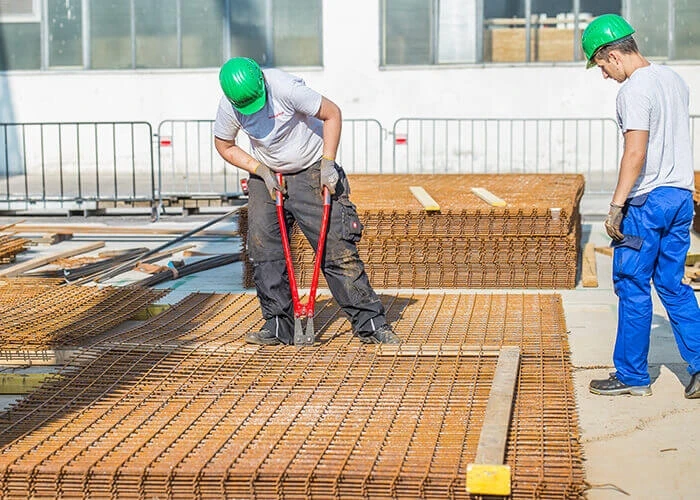 Local workers are trained to operate a plant