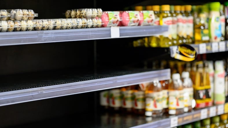 Empty shelves in a grocery store.