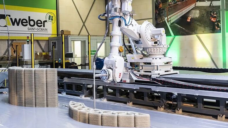 A 3D printer generates a concrete structure. 