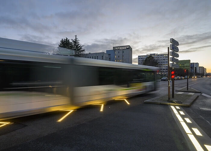 Blurred image of a bus in an intersection