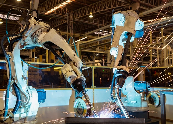 robotic arms welding in factory