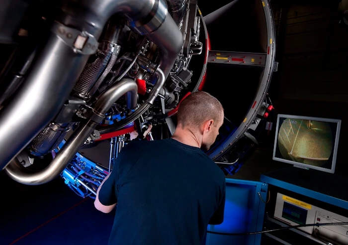 A man works on aerospace parts