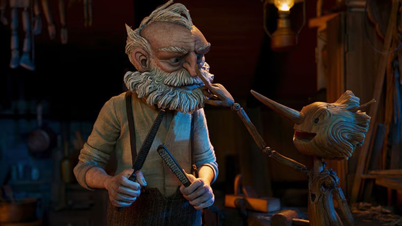 A wooden Pinocchio points to his maker, Geppetto.