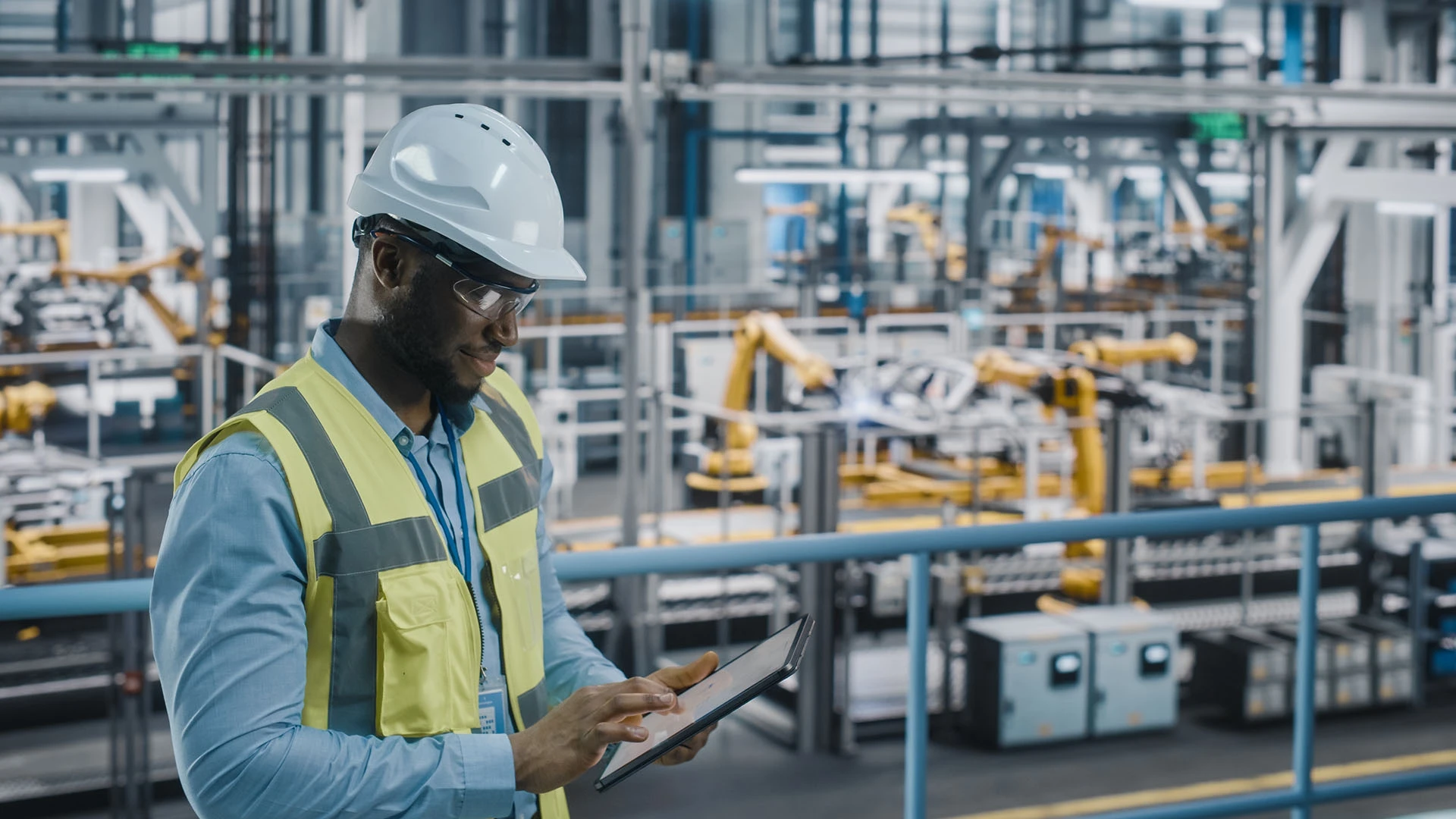 person working on an iPad on the factory floor