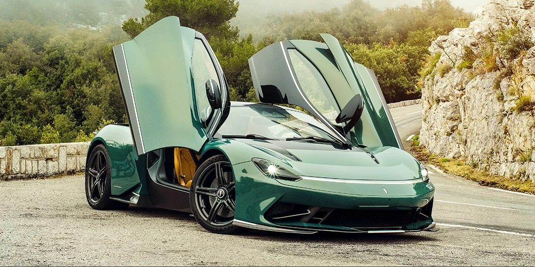 A green Pininfarina Battista with its doors open