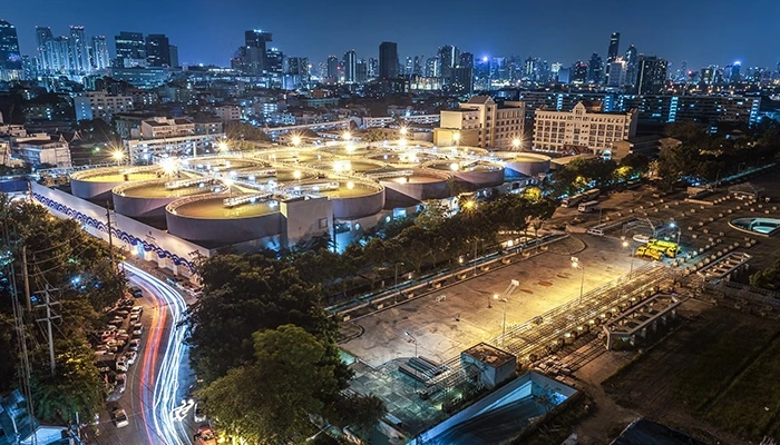 An overhead view of a water treatment plant at nighttime