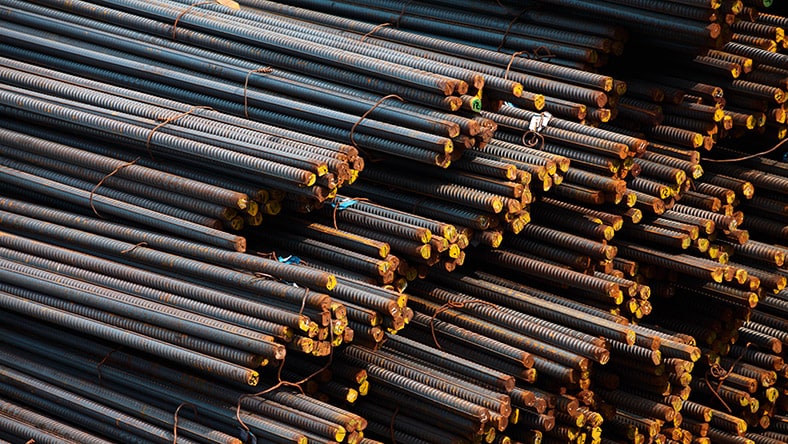 Piles of rebar awaiting use in a green construction project.