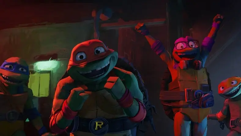 A still from Teenage Mutant Ninja Turtles: Mutant Mayhem shows the turtles celebrating.