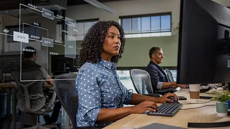 Woman using Autodesk Fusion engineering change management software