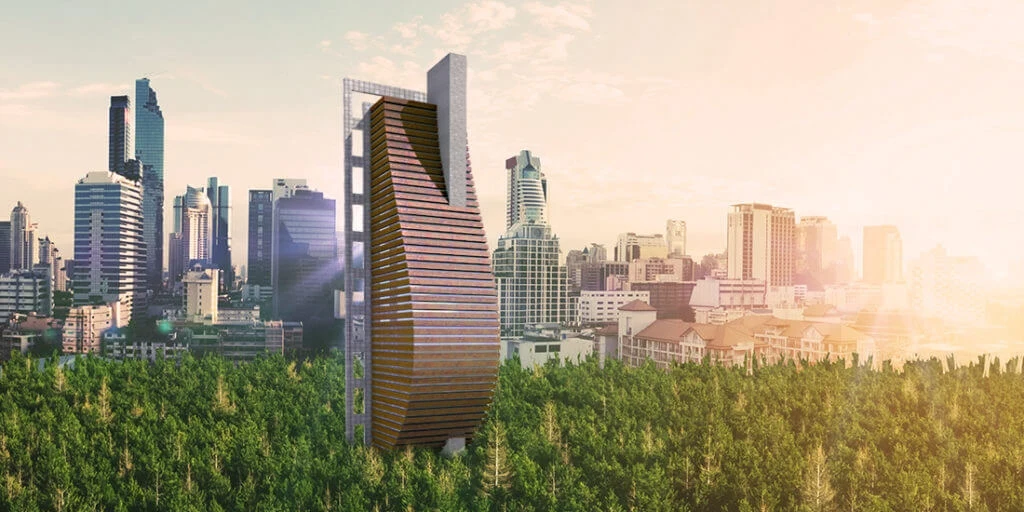 Tall buildings rising out of wooded area