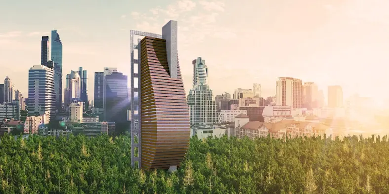 Tall buildings rising out of wooded area