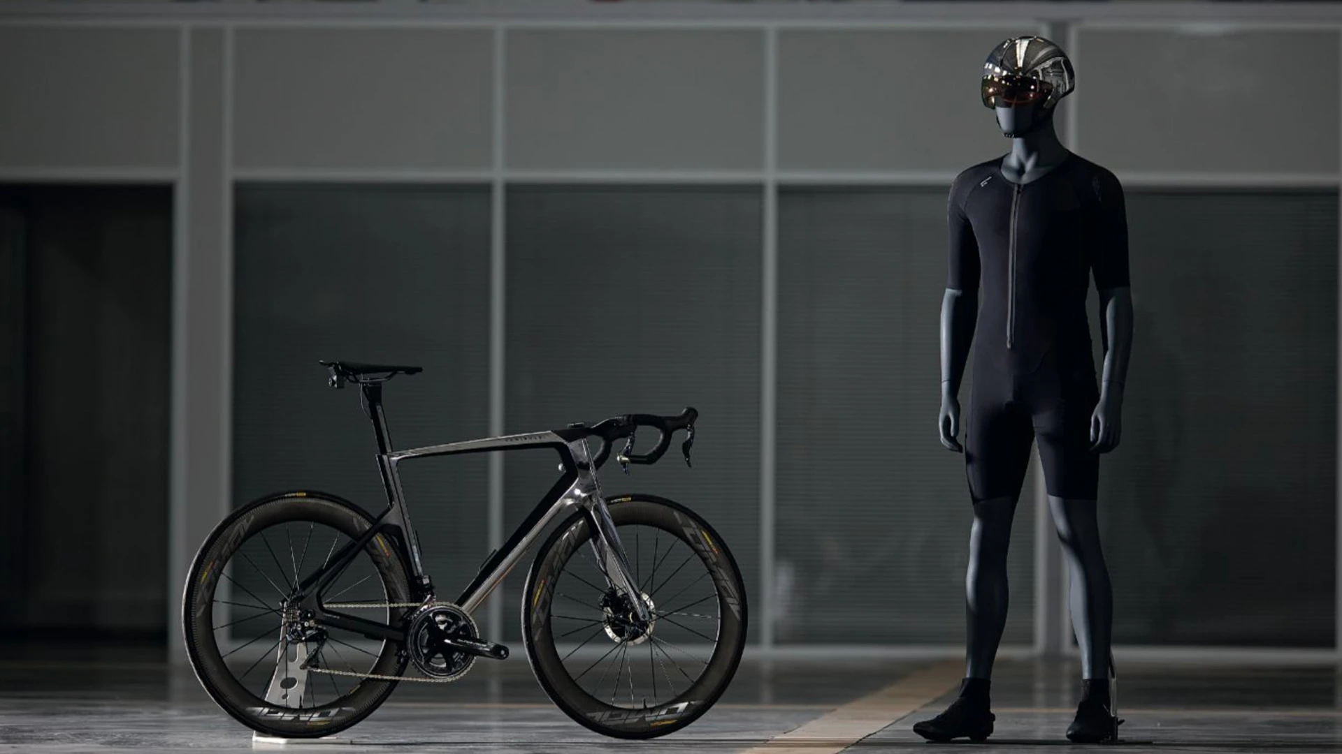 Rendering of a Decathlon bike next to a mannequin in futuristic cycling gear
