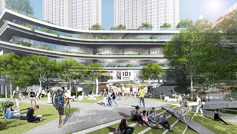 A modern and sustainably constructed campus with students on the lawn.