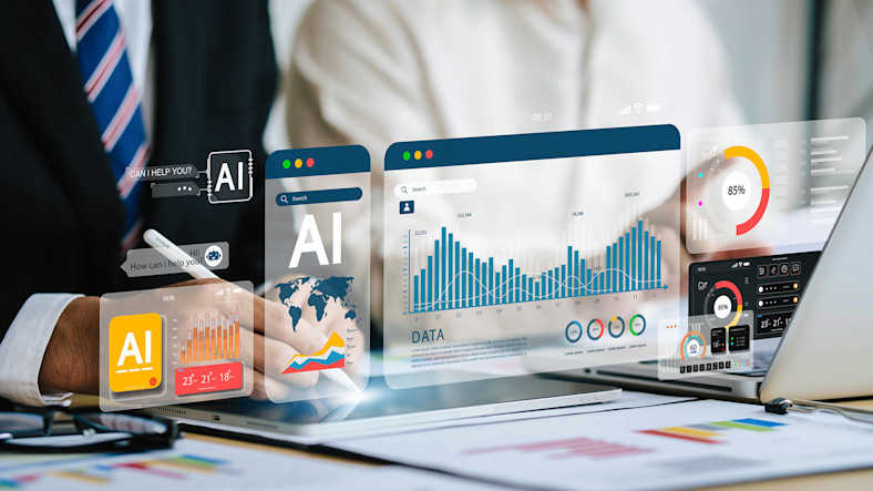 Futuristic images representing artificial intelligence rise from a computer screen.