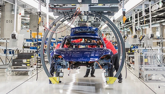 A Porsche Taycan being built on the line in Stuttgart, Germany
