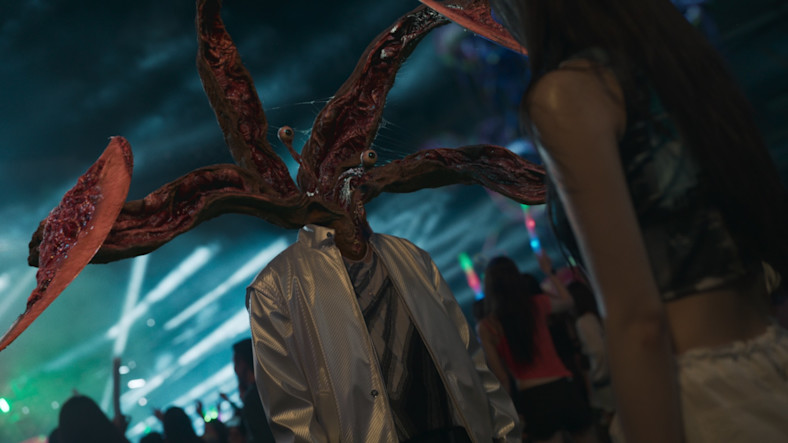 A still from Parasyte: The Grey shows a person with alien tentacles and eyeballs on stalks in place of a human head.
