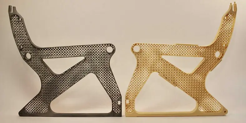 Two generatively designed metal airplane seat frames cast in metal