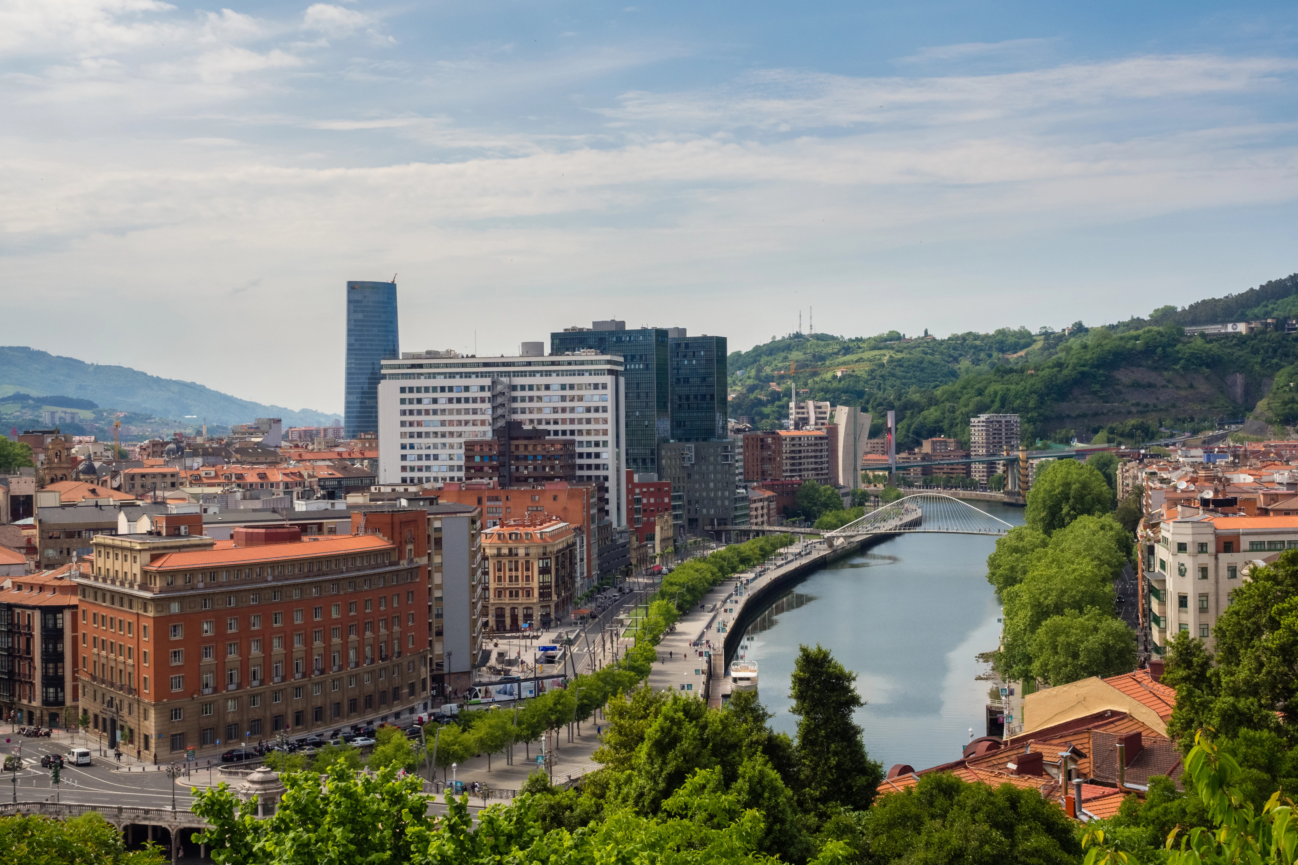 The Nervión estuary in front of Bilbao's Old Town, with La Ribera market in the background. 