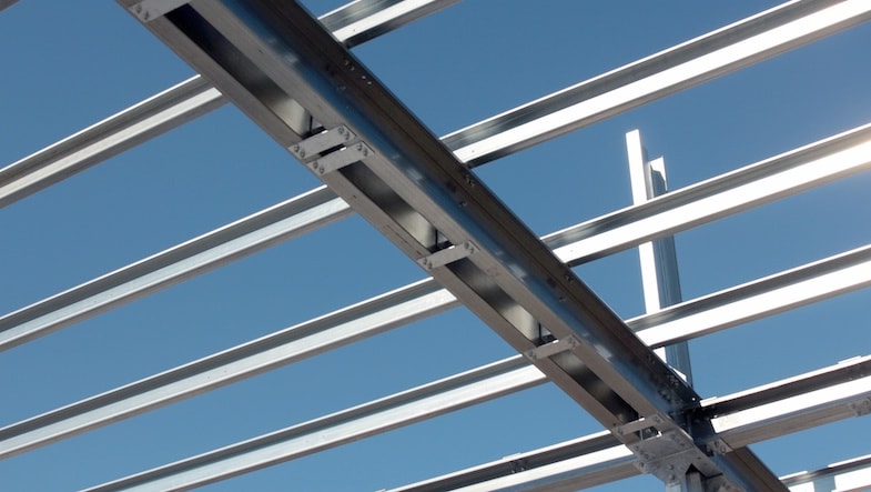 Light-gauge steel forms a building frame.