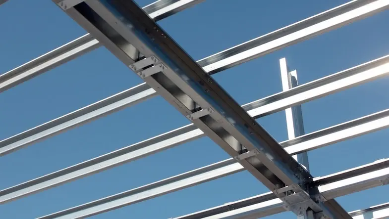 Light-gauge steel forms a building frame.
