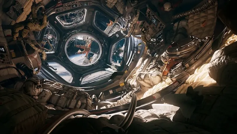 A 3D rendering shows the view from the cockpit of a spaceship.