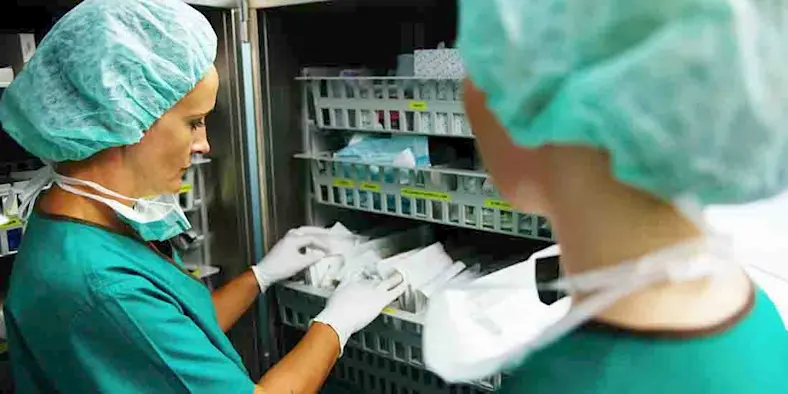 Manufacturing COVID-19 hospital staff in protective gear access supplies