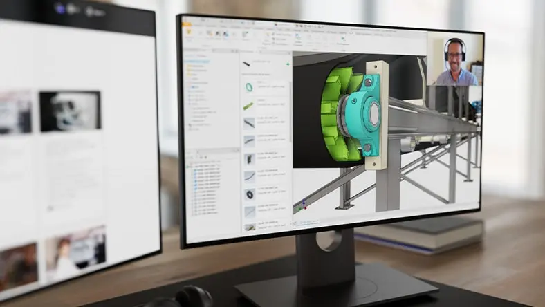 Computer monitor displaying conveyor model and webinar speaker
