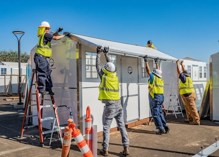 Pallet employees assembling shelters