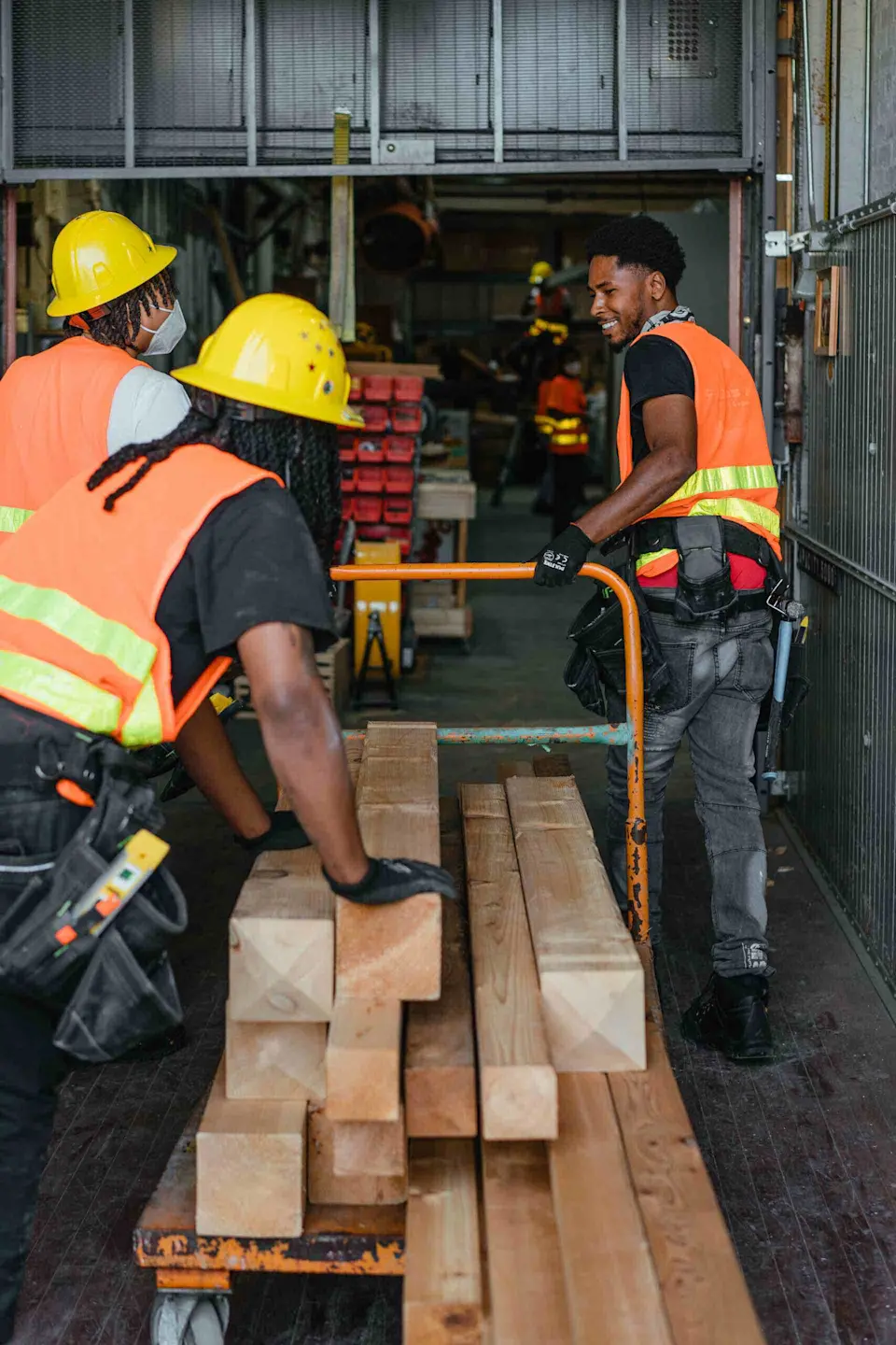 Revolution Workshop trainees moving materials at the organization’s second training site in Pullman, Chicago