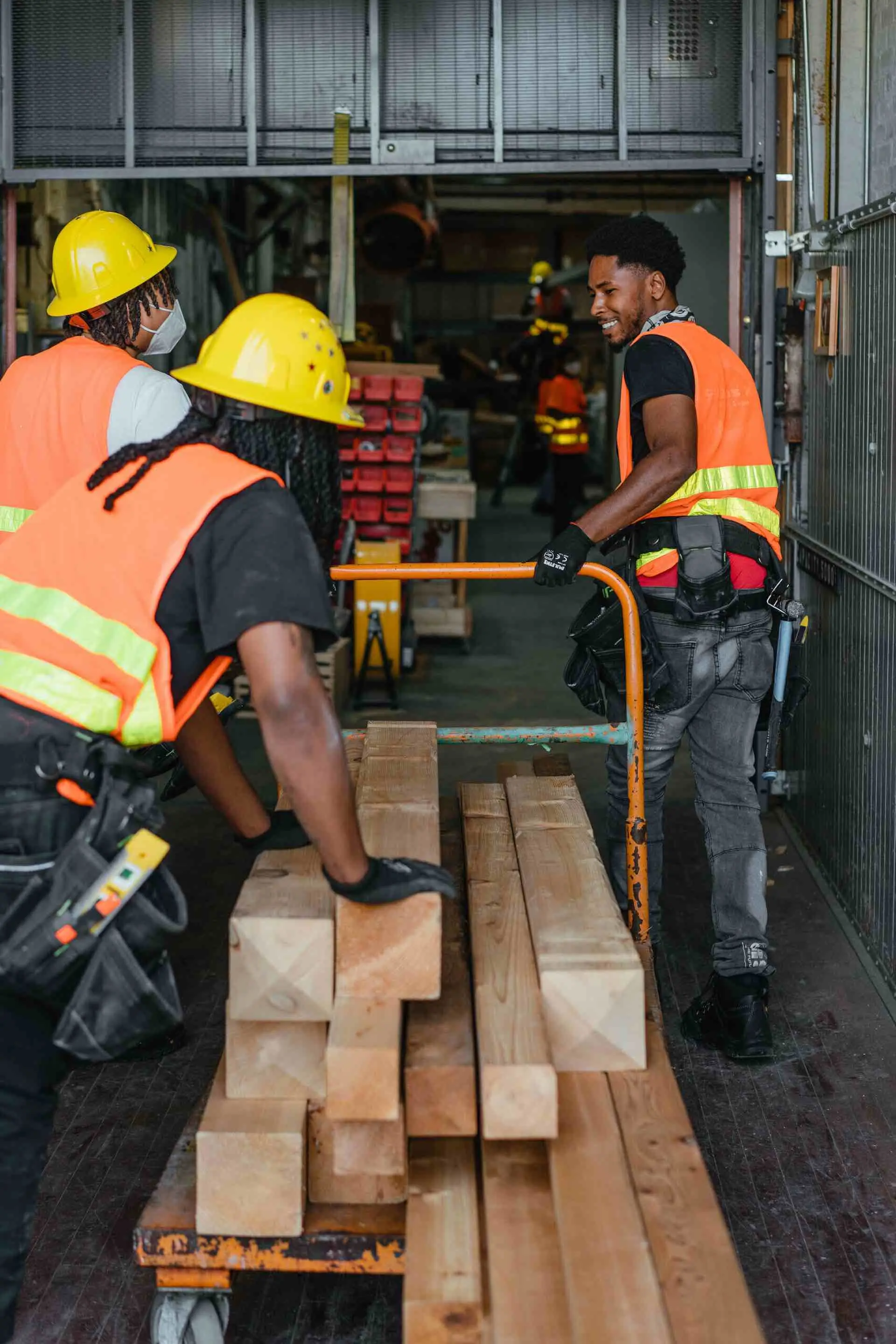 Revolution Workshop trainees moving materials at the organization’s second training site in Pullman, Chicago