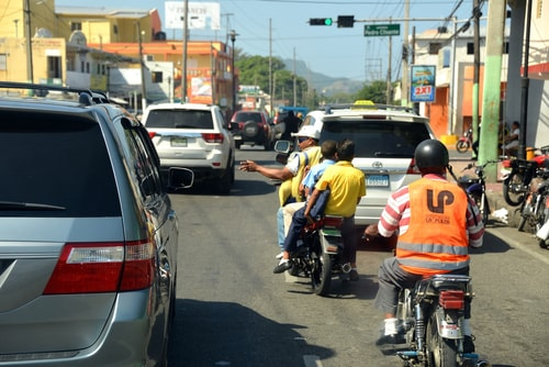 3 on motorcycles is common on the entire road network