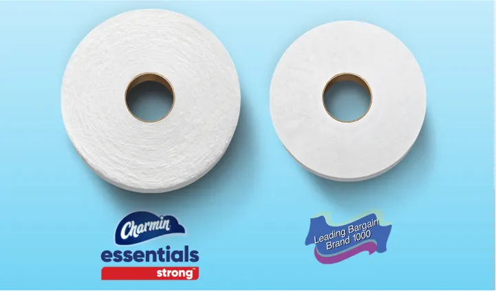 Side by side of Charmin Essentials Strong roll next to competitor roll