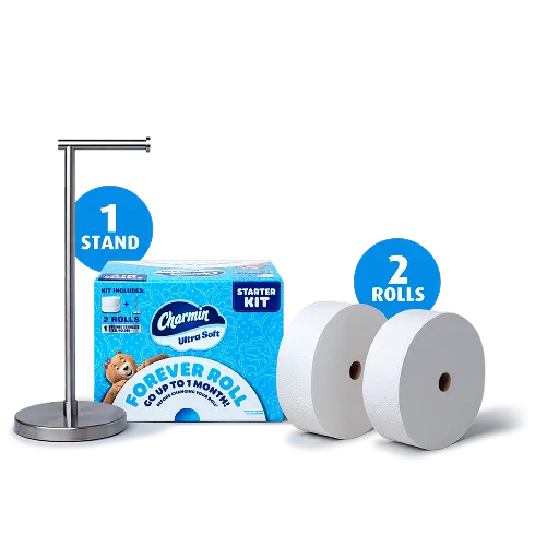 Portarrollos de papel higiénico de acero inoxidable cepillado prémium y 2 rollos Forever Roll juntos al lado de un paquete del Charmin Forever Roll Starter Kit