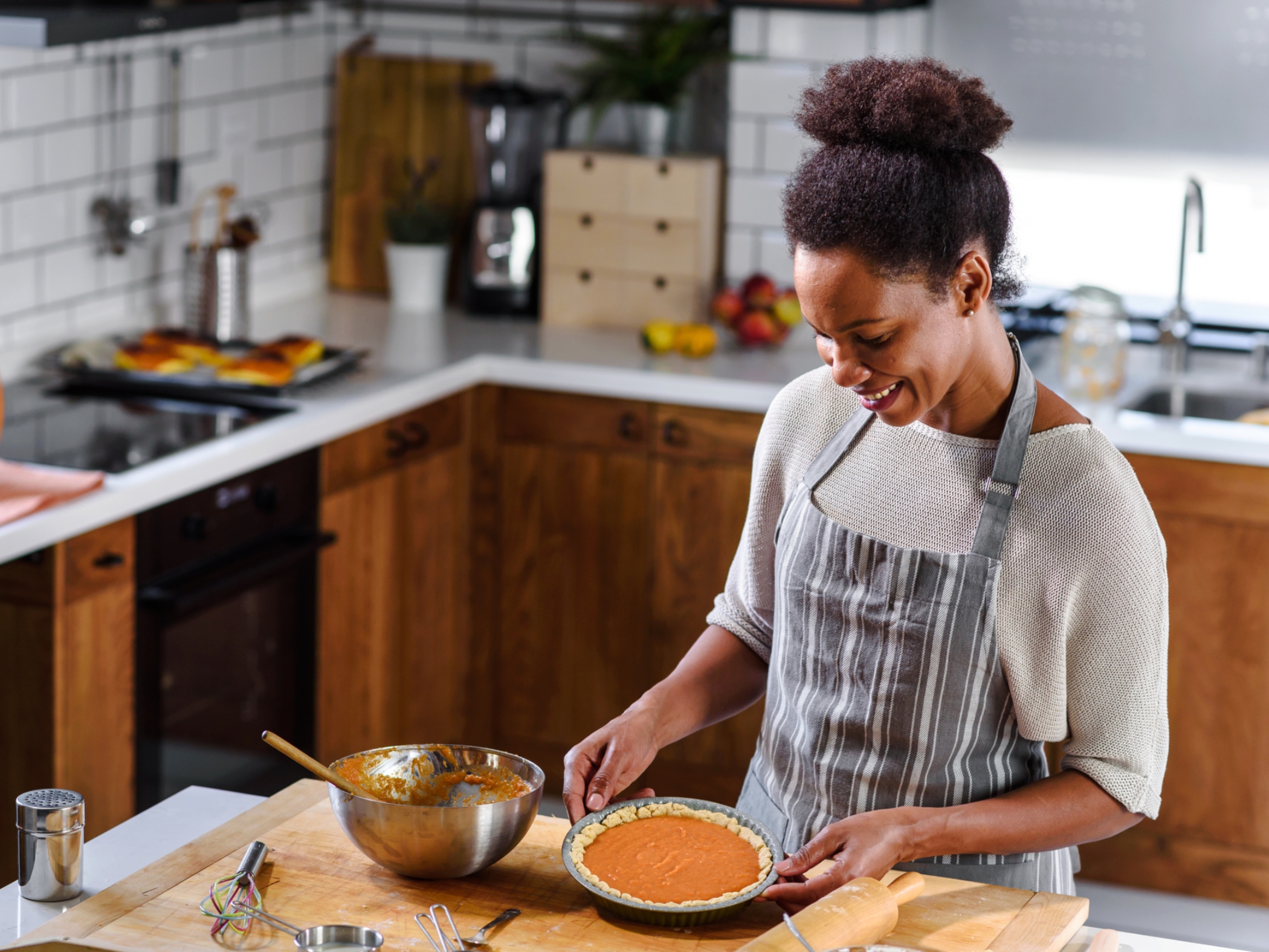 Woman baking pumpkin pie