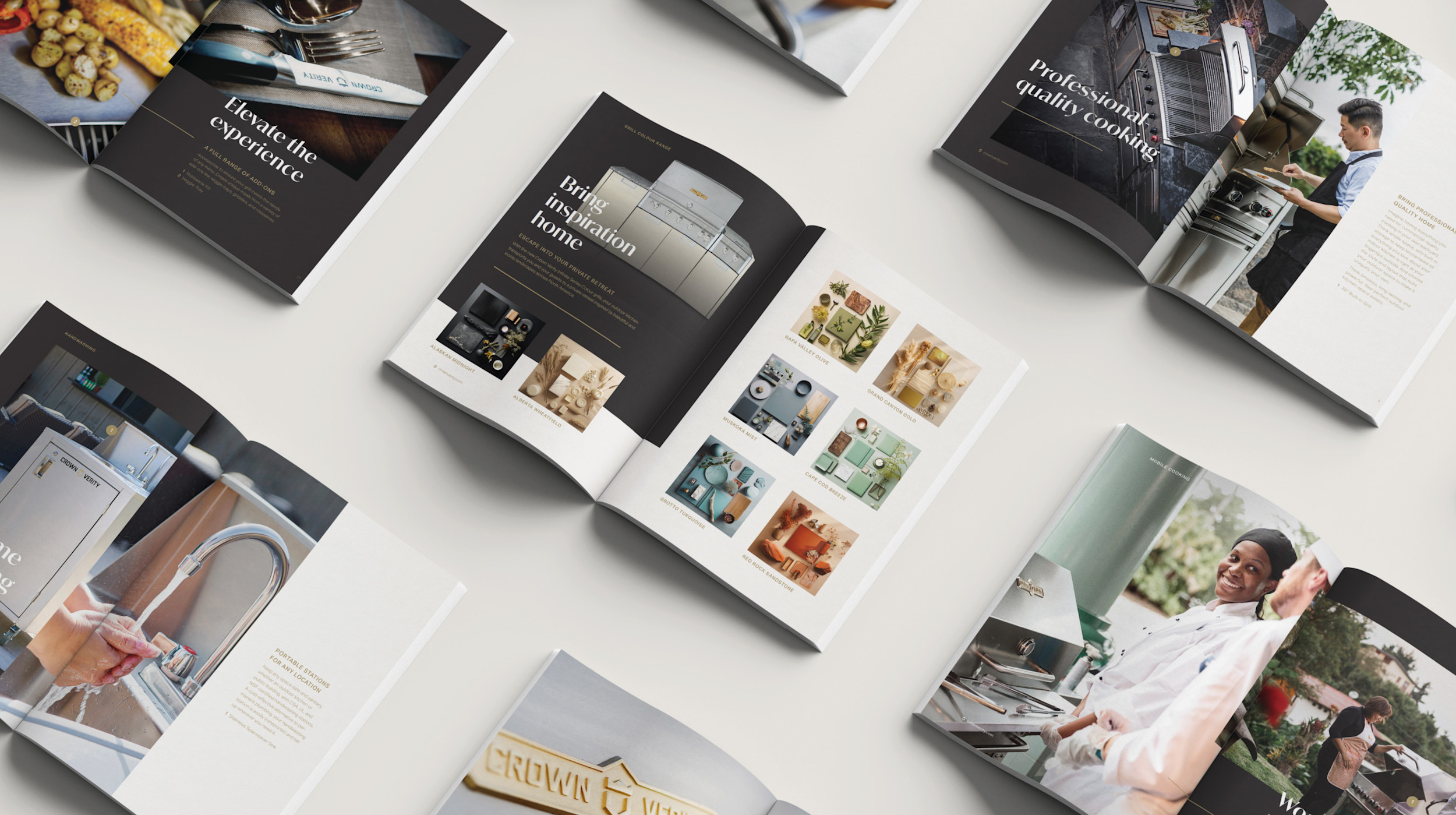 multiple open brochures laid out on table