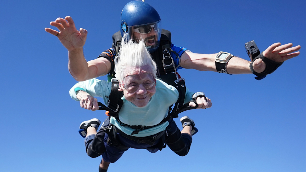 Close-up image showing Dorothy Hoffner and her tandem skydive leader.