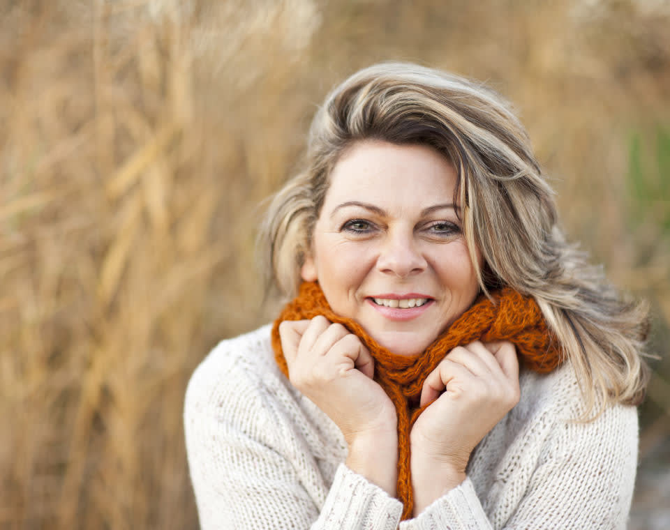 middle-aged-woman-hugging-her-scarf-i-screen