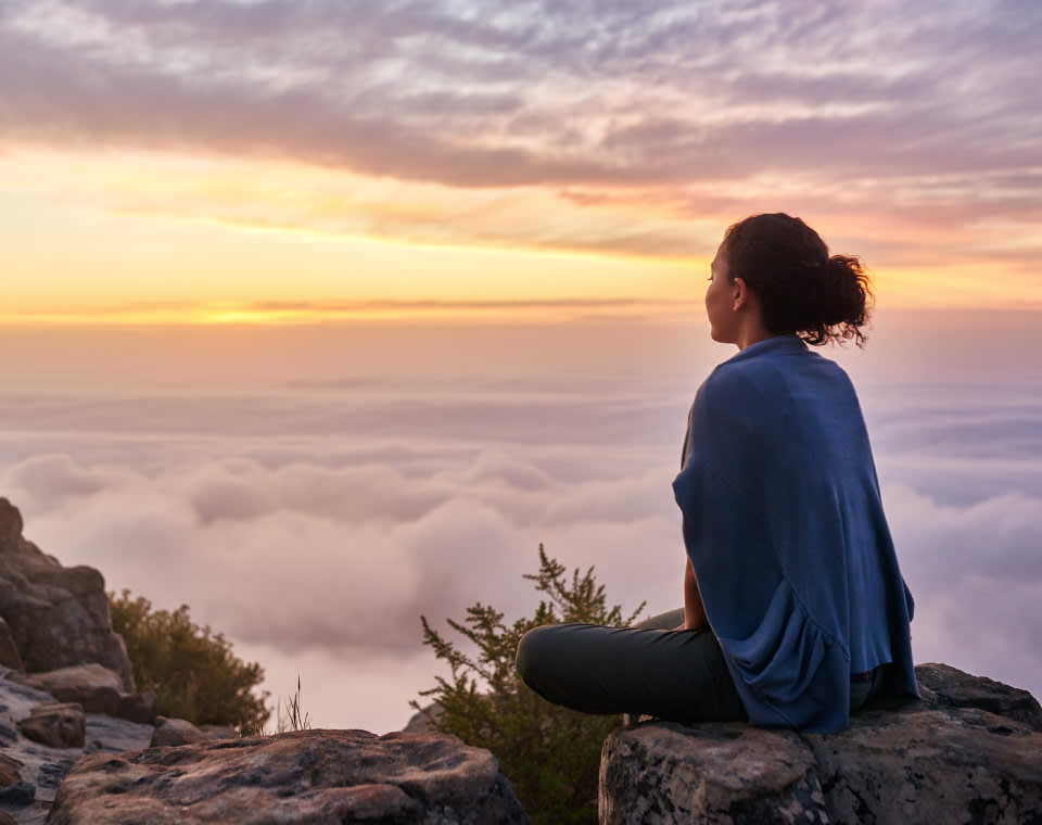 woman-sitting-on-mountain-soaking-in-twilight-i-screen