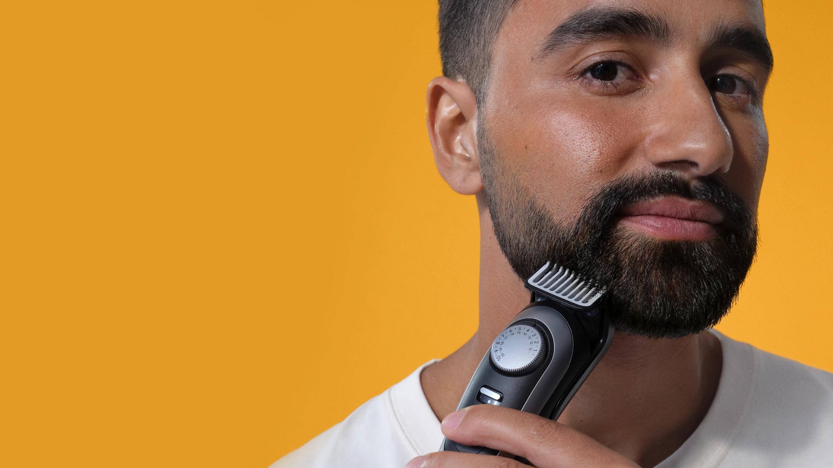 Man using Beard trimmer on beard