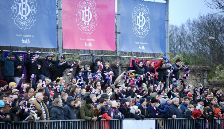 Dulwich Hamlet fans celebrating in front of Bulb banners
