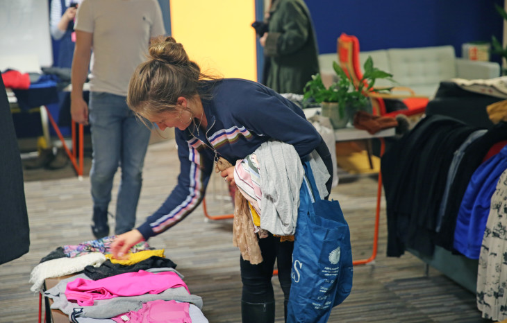 Team Bulb member shopping for clothes in our Bulb Clothes Swap