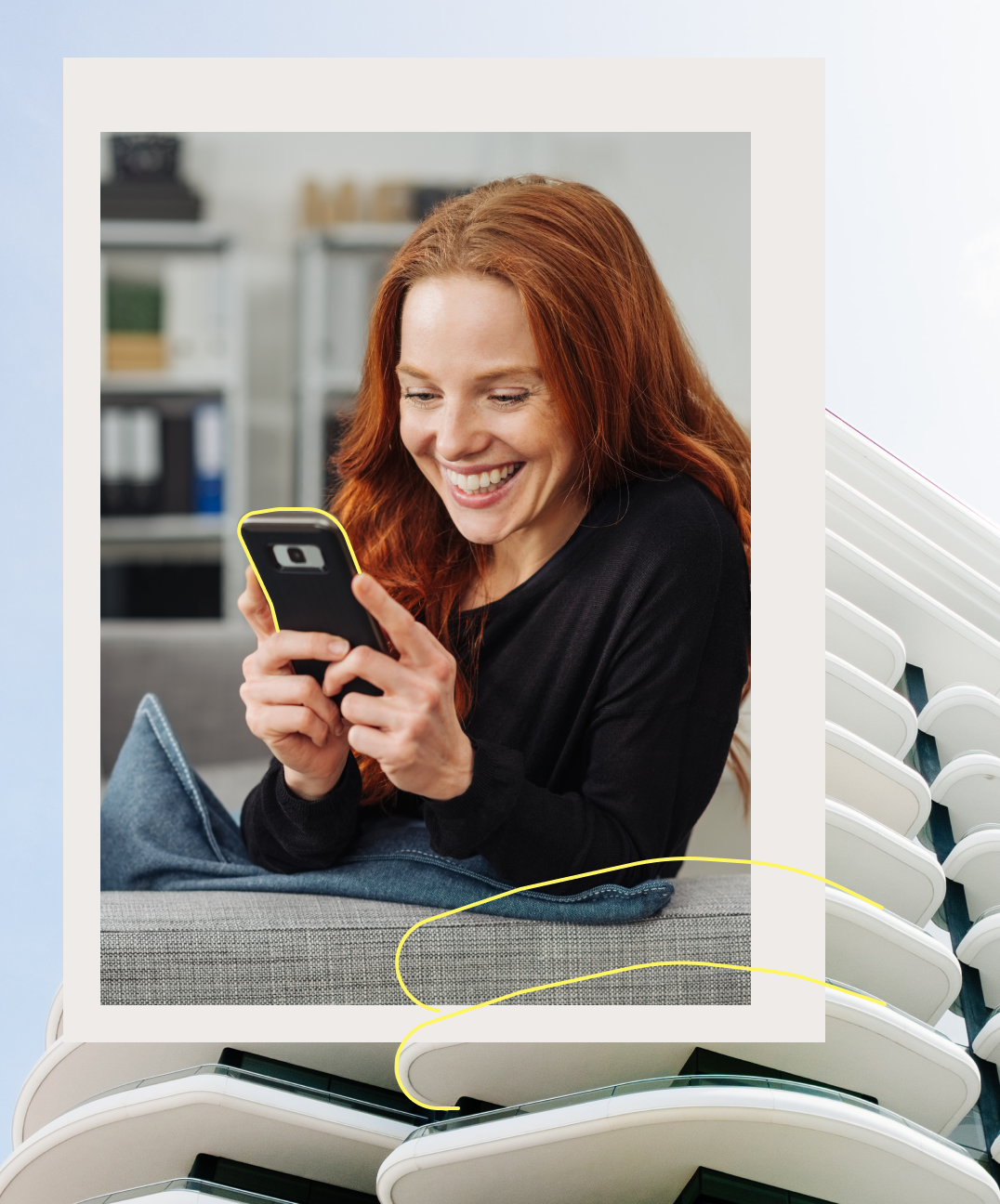 Laughing woman with smartphone in background real estate