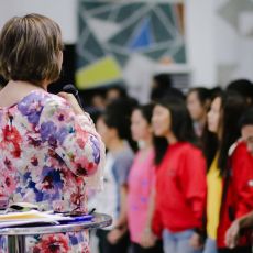 Cristina Sosso praying in front of the crowd at CCFI-Gensan in General Santos City