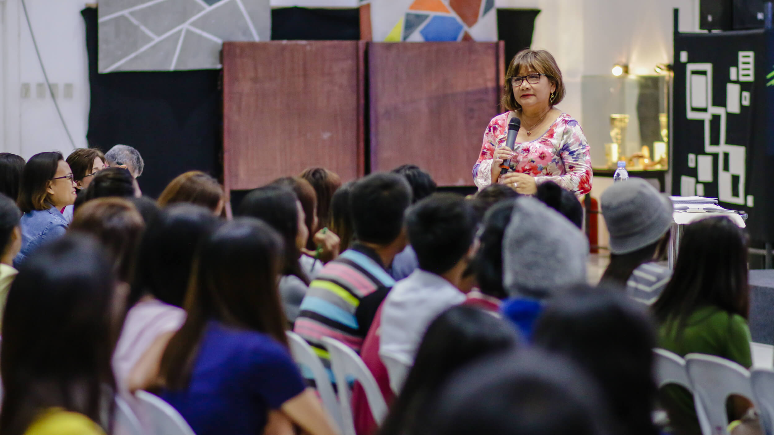 Cristina Sosso speaking to the audience at CCFI-Gensan in General Santos City.
