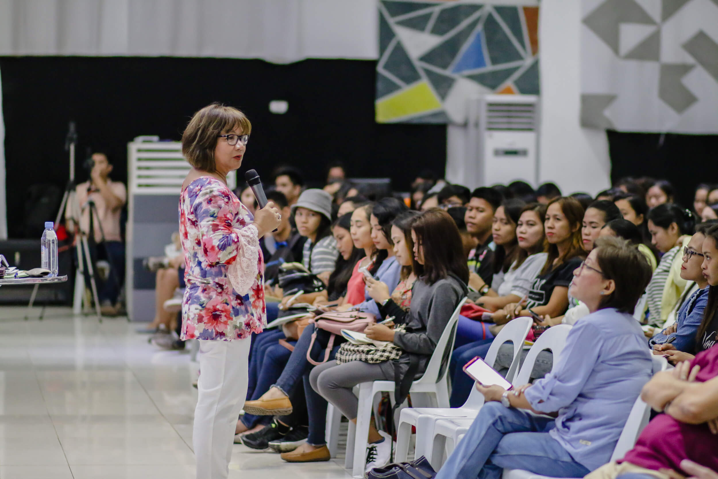Cristina Sosso speaking to the audience at CCFI-Gensan in General Santos City.